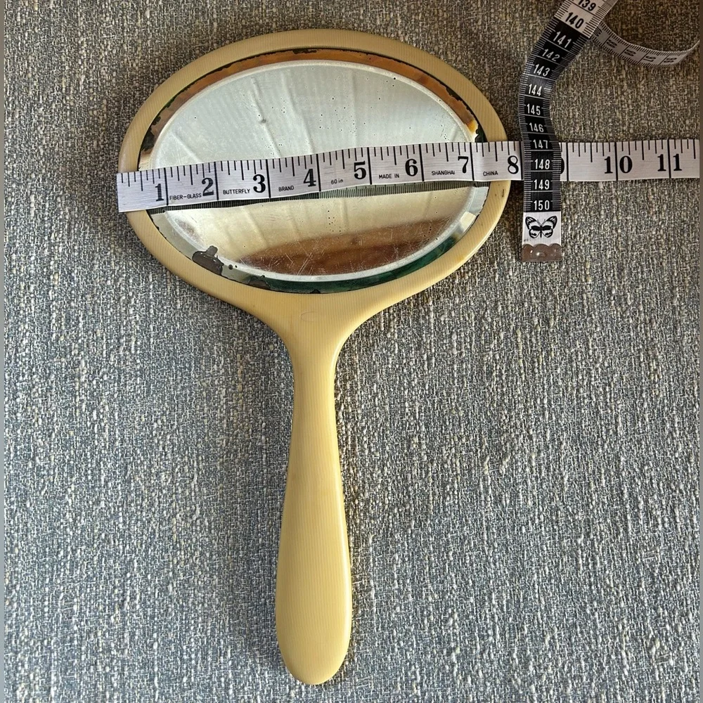 Vintage Handheld Mirror with light yellow Frame